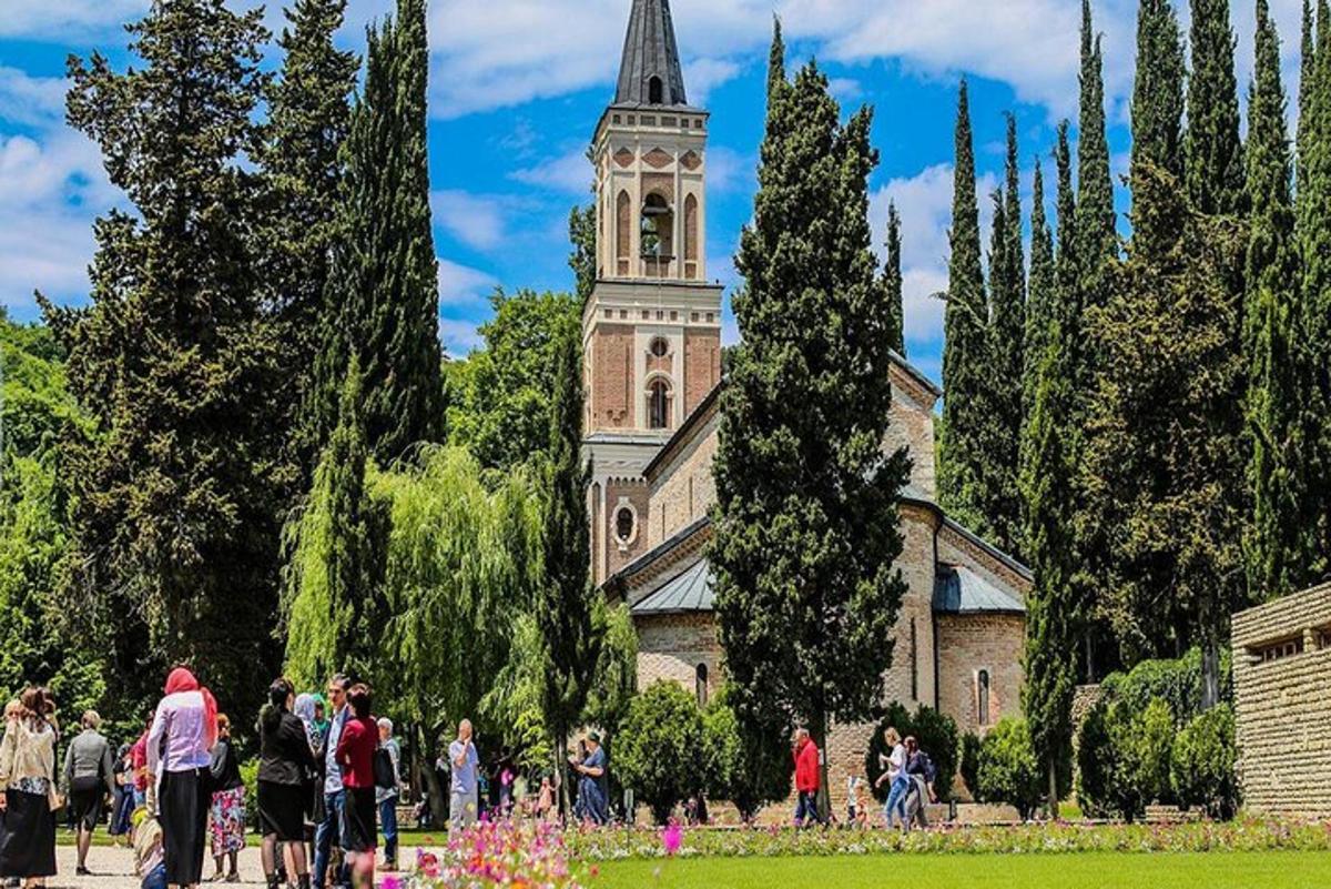 a group of people walking in front of a church