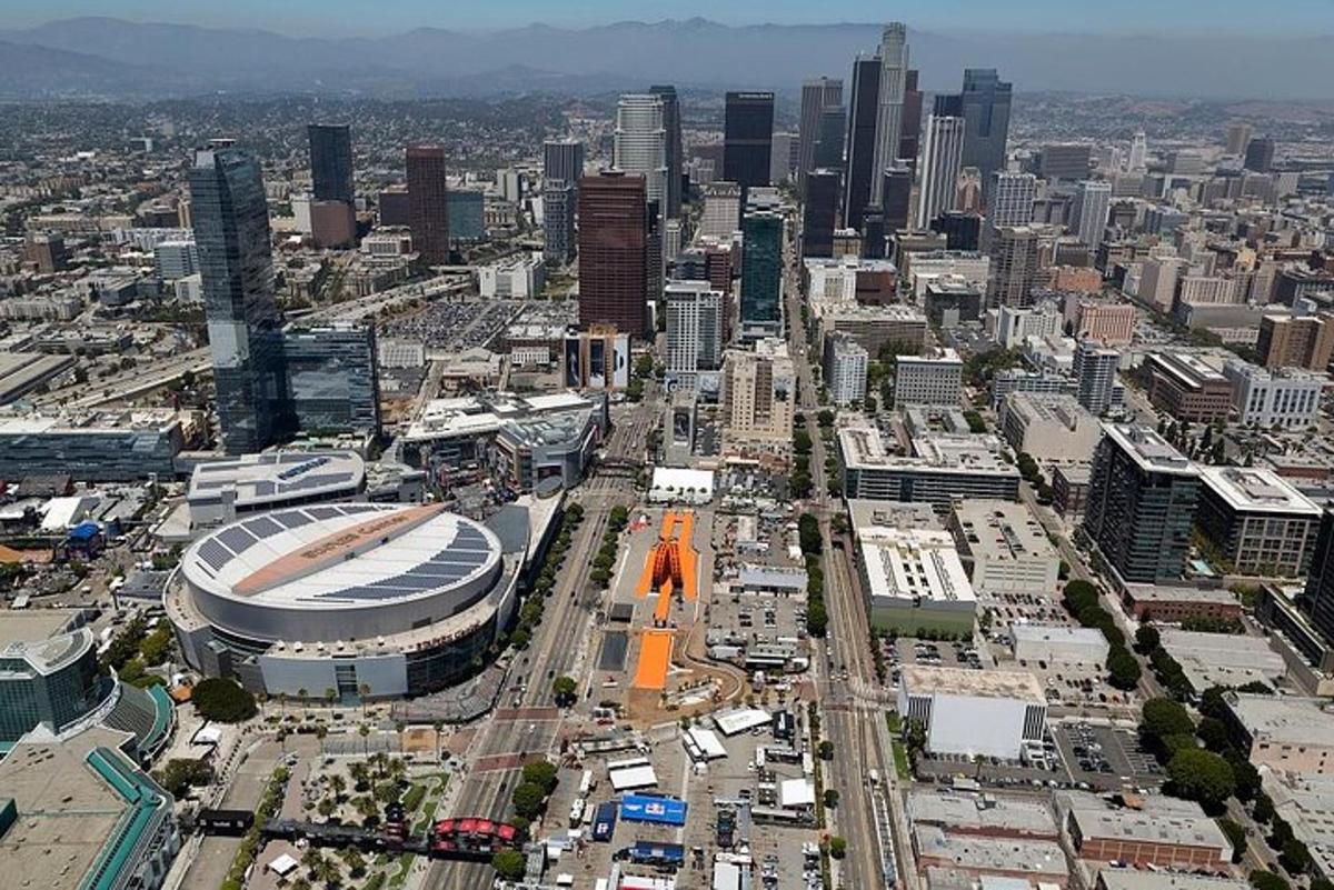 an aerial view of a large city with a stadium