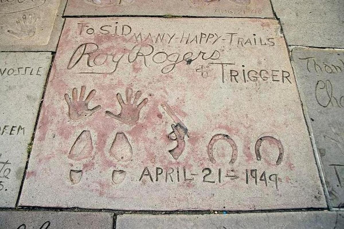 a sidewalk with some writing on the ground