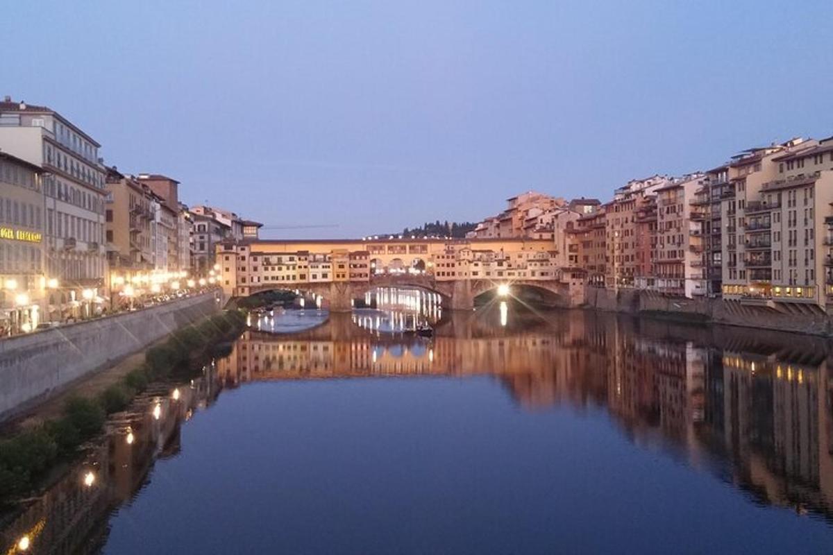 a bridge over a river in a city with buildings