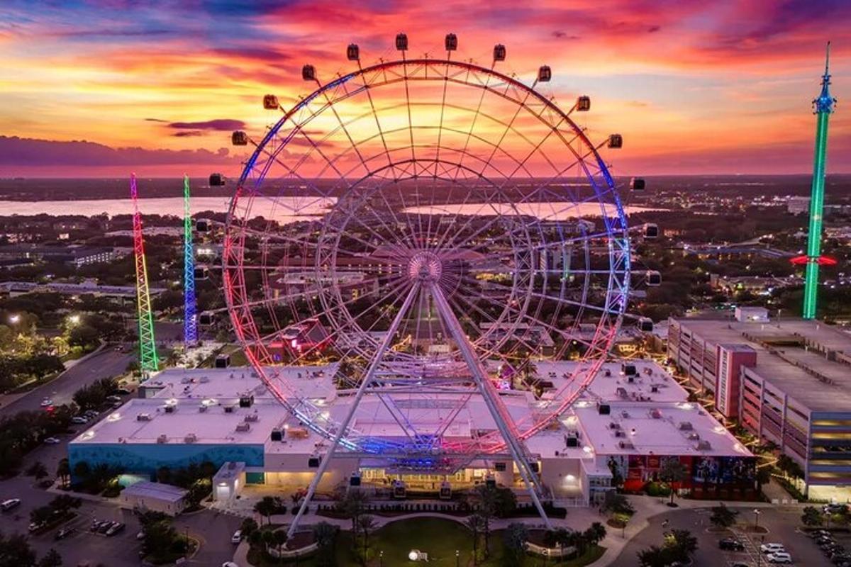 a ferris wheel at a carnival at sunset