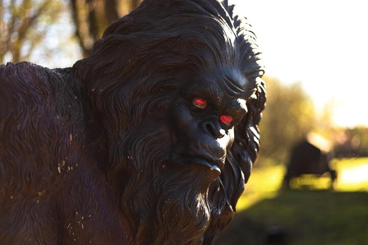 a statue of a black dog with red eyes