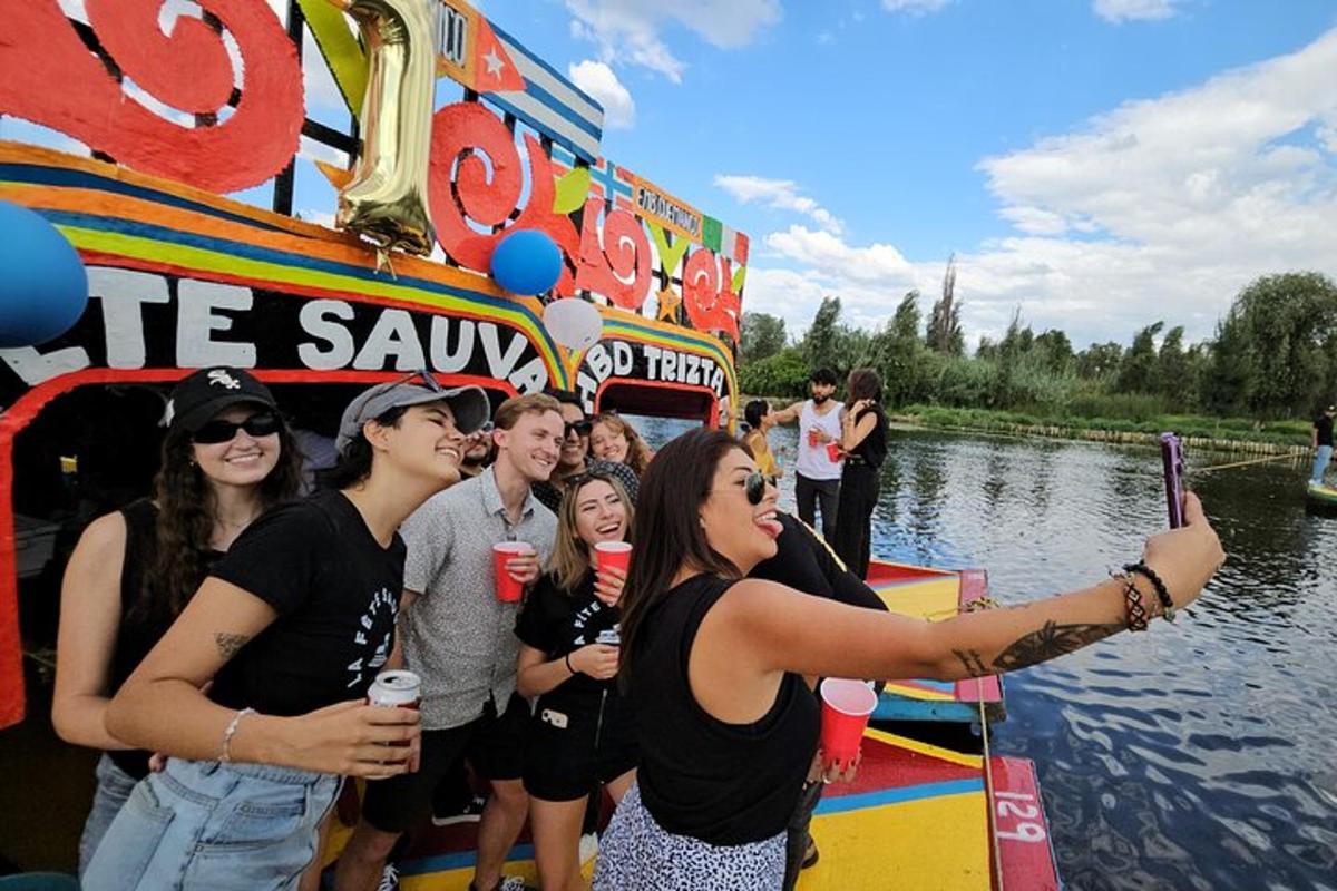 a woman taking a picture of a group of people on a boat