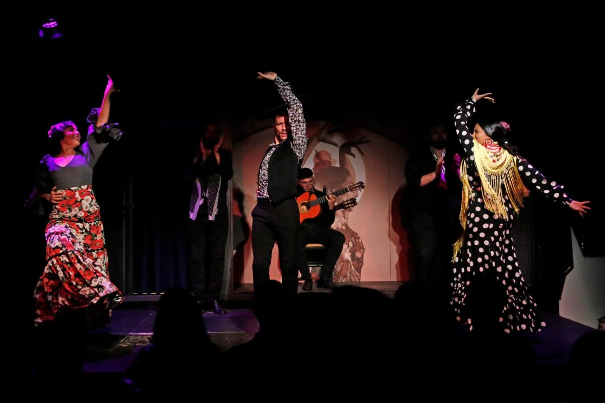 a group of people dancing on a stage