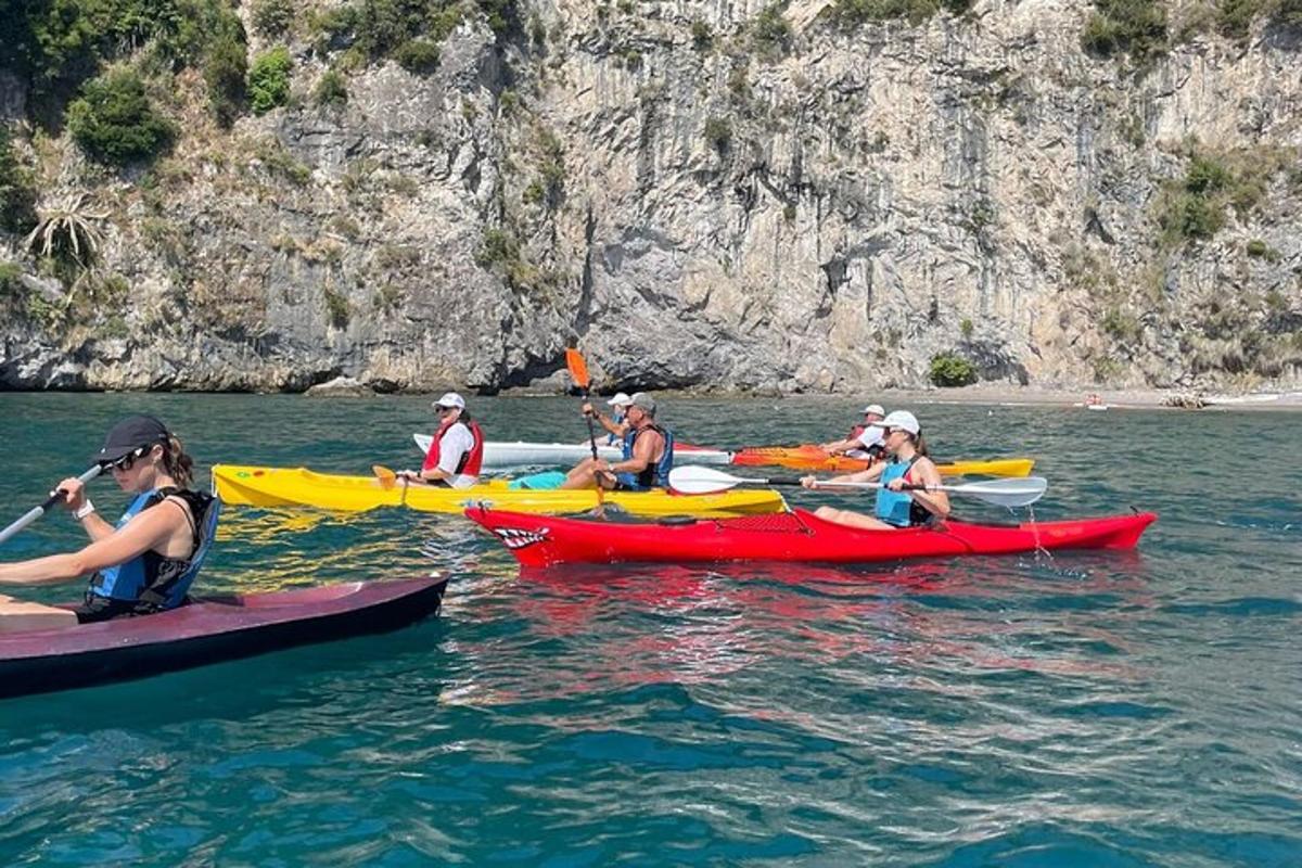 a group of people in kayaks in the water
