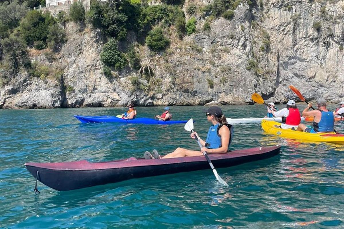 a group of people in kayaks in the water