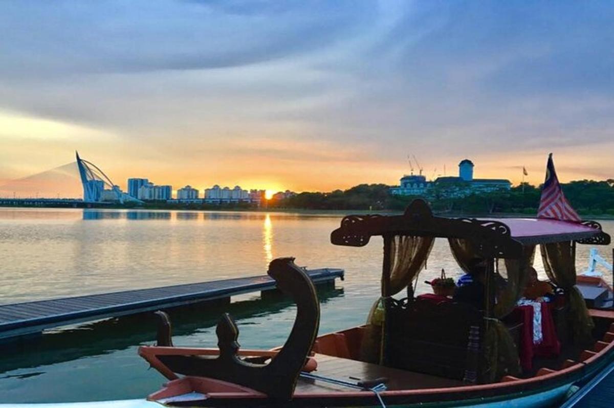 a boat on the water with the city in the background