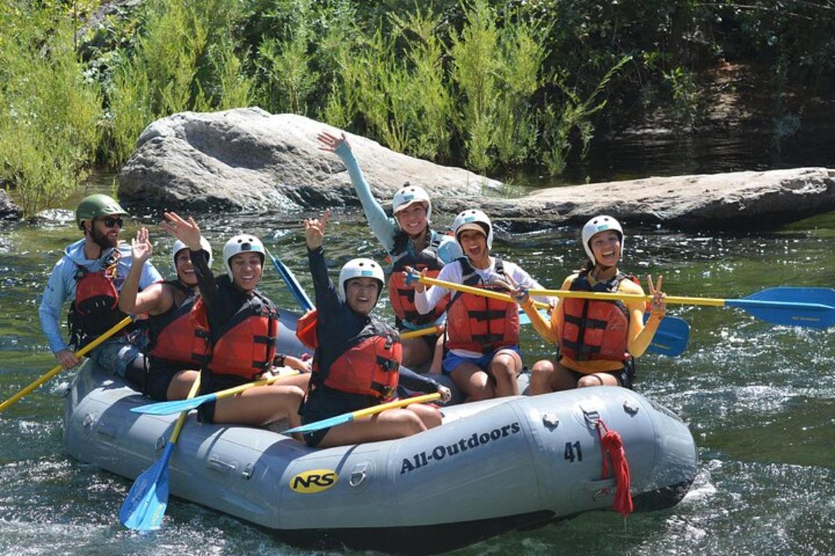a group of people in a raft on a river