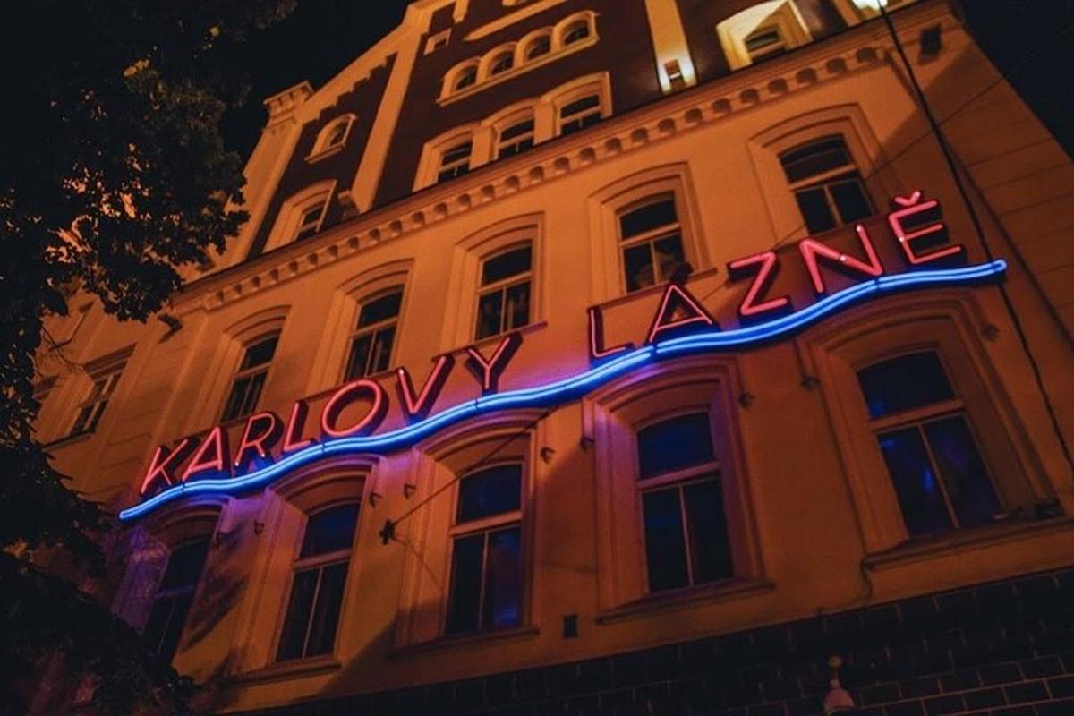 a neon sign on the side of a building