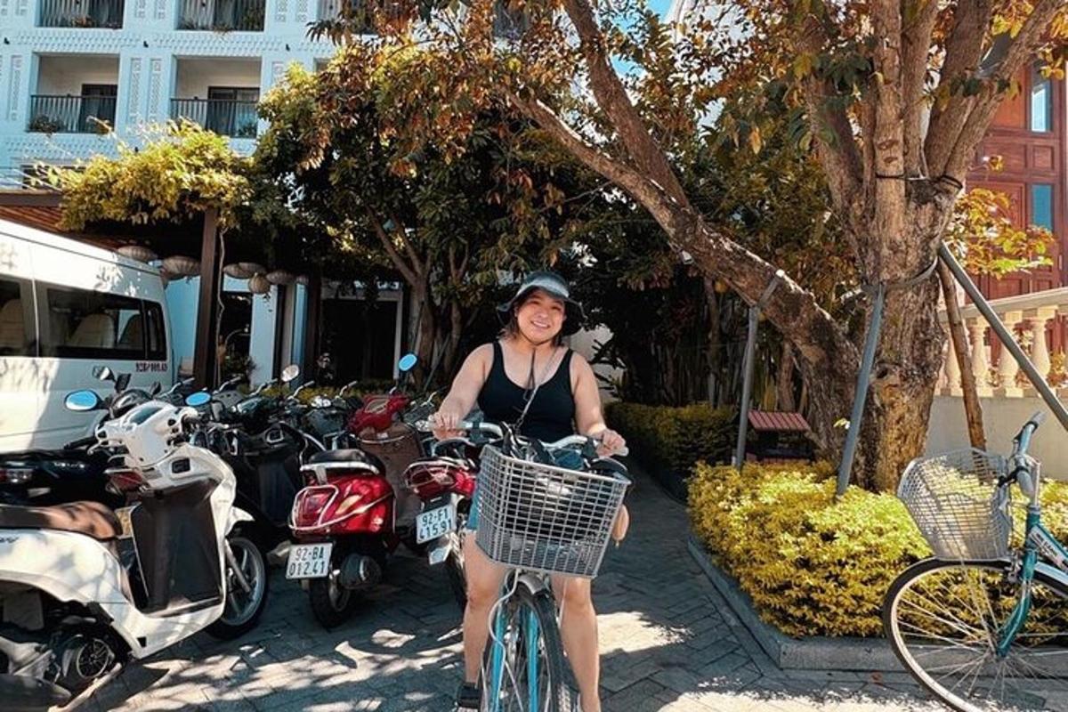 a woman is smiling while riding a bike