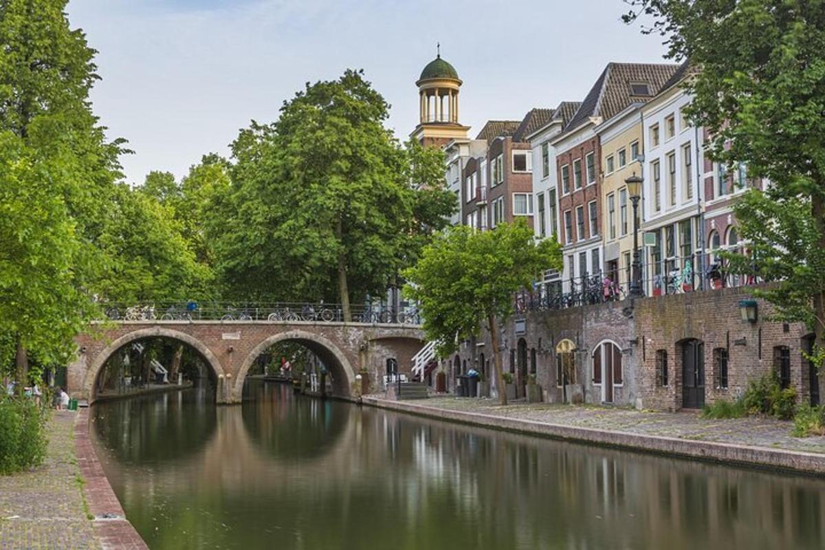 a bridge over a river in a city with buildings