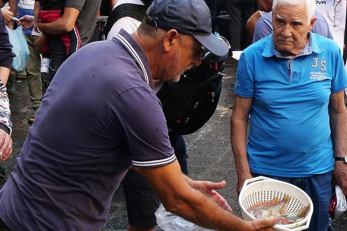 a man holding a basket with a bird in it