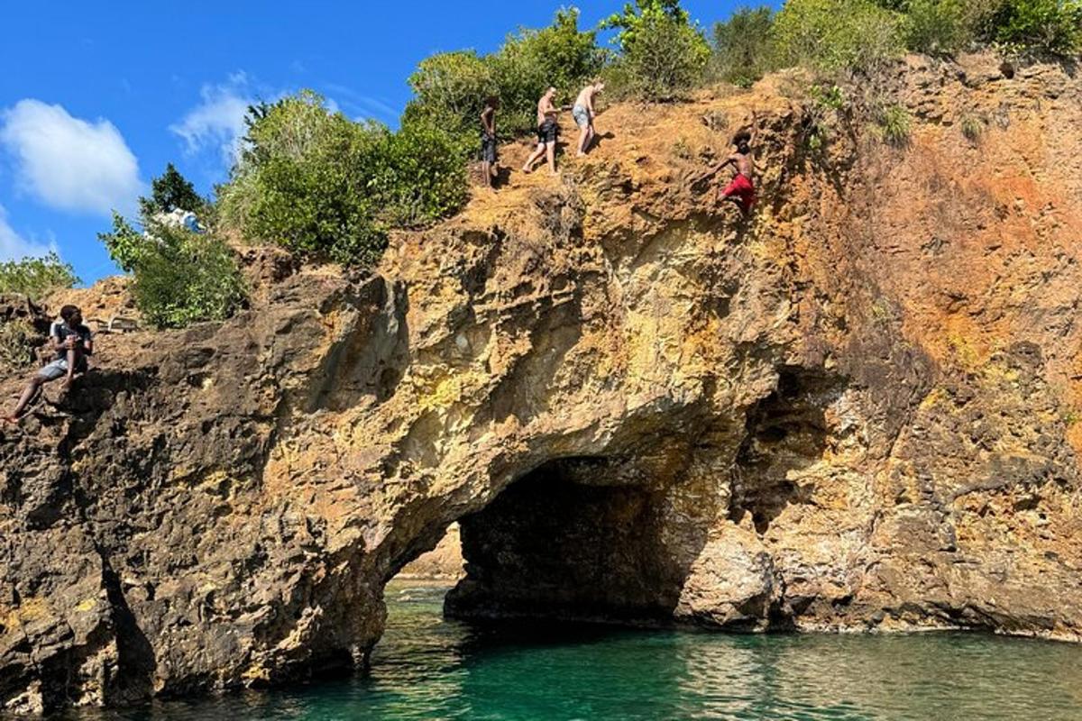 a group of people standing on a rocky cliff