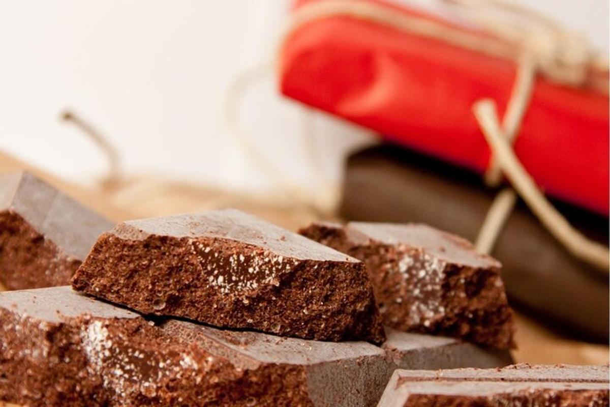 a pile of brownies sitting next to a red toaster