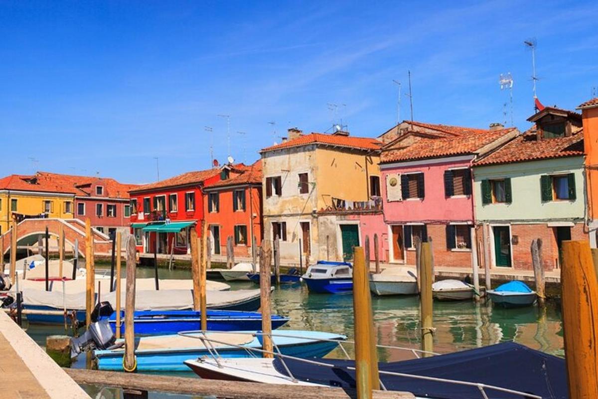a group of colorful houses and boats in a harbor