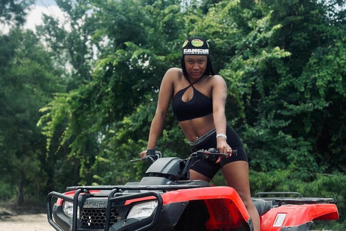 a woman in a bikini standing on a motorcycle