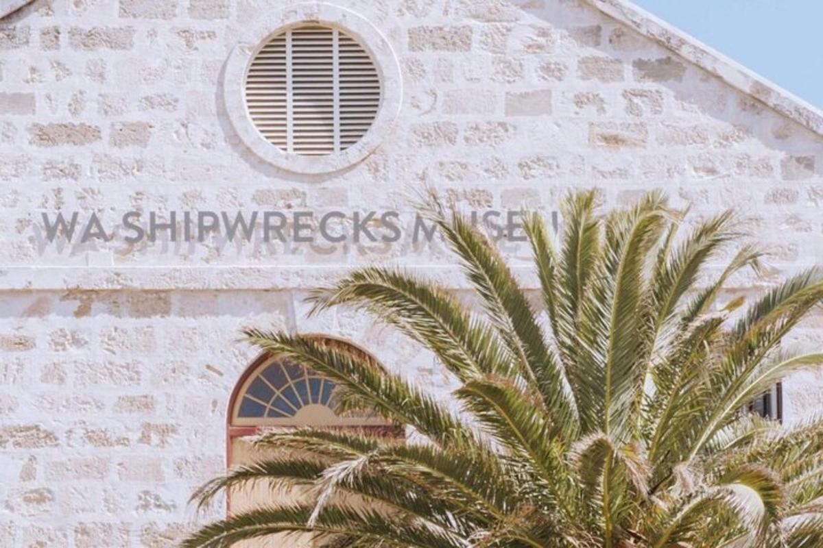 a church with a palm tree in front of it