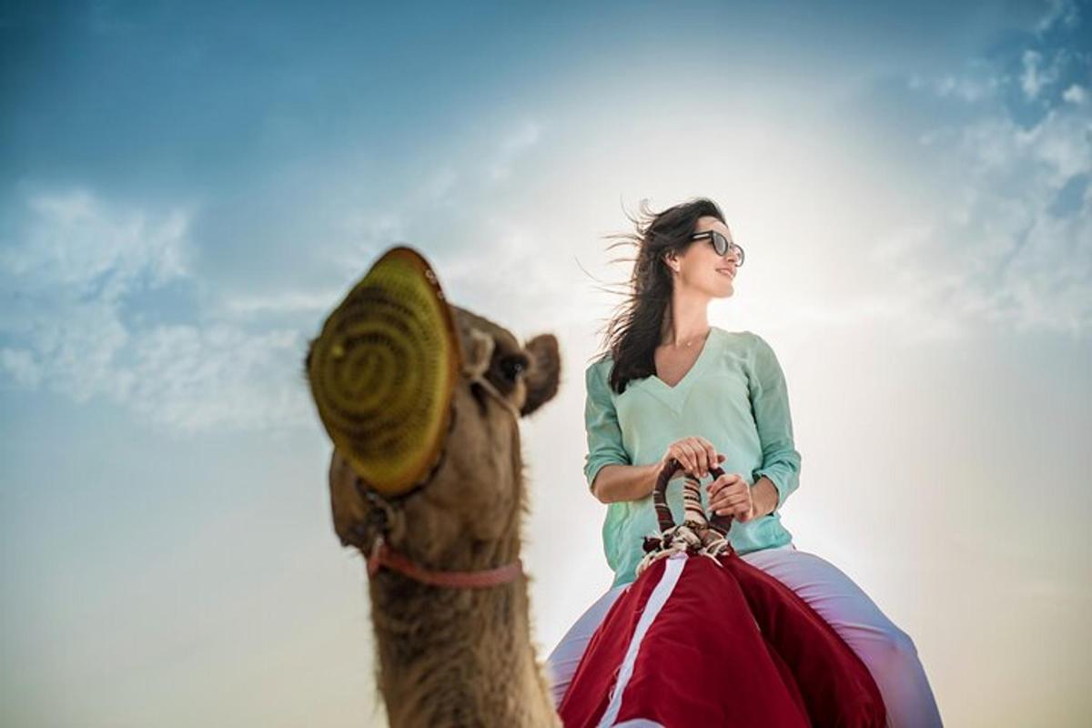 a woman riding on the back of a camel