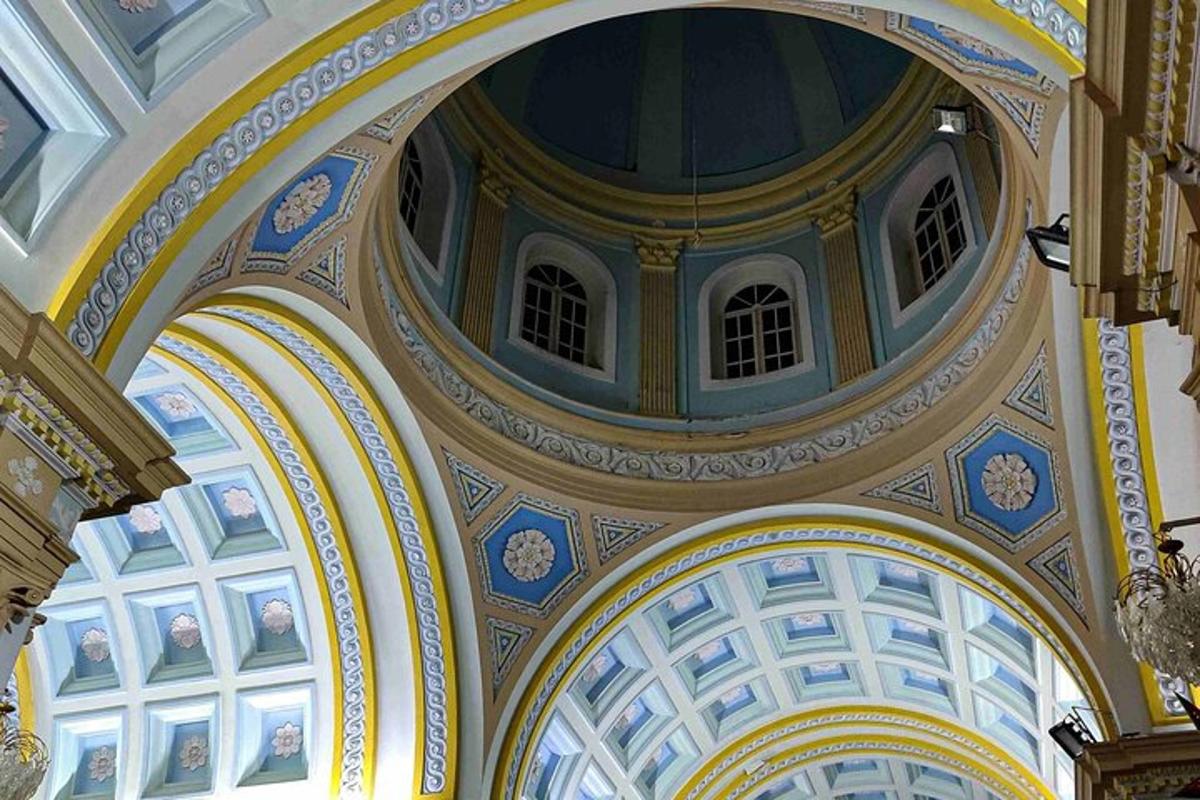 a building with a ceiling with paintings on it