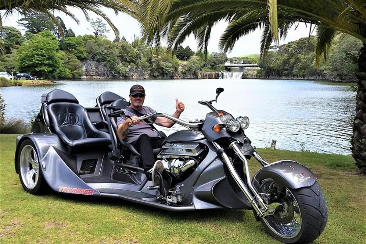 a man giving a thumbs up while riding a motorcycle
