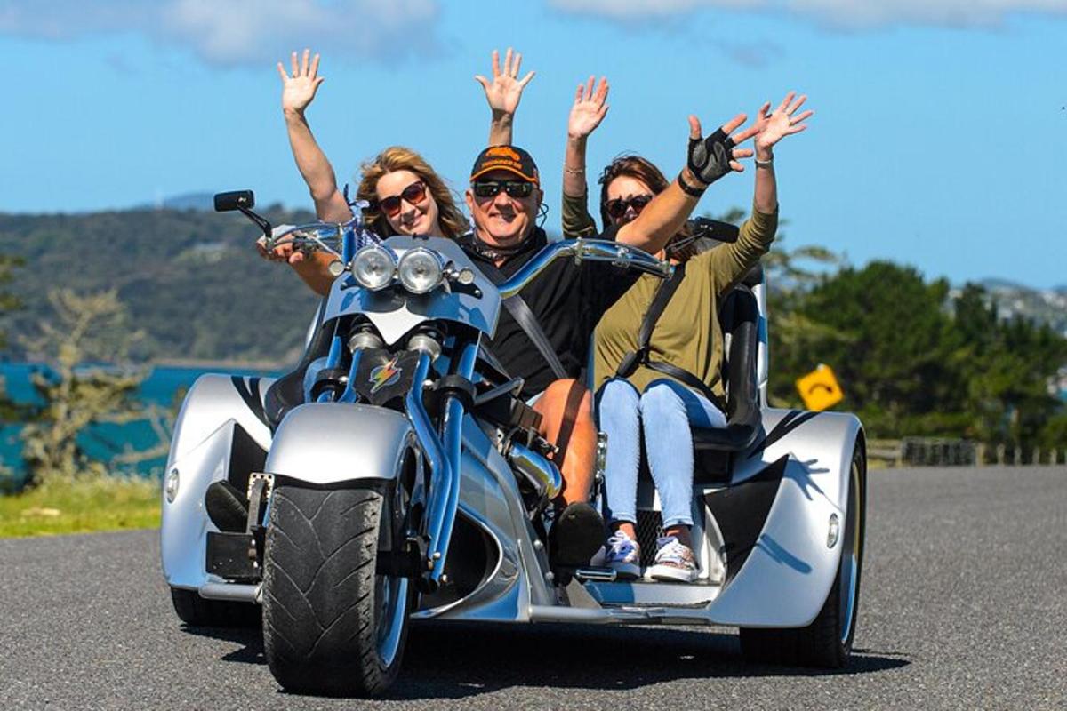 a group of people riding on a motorcycle