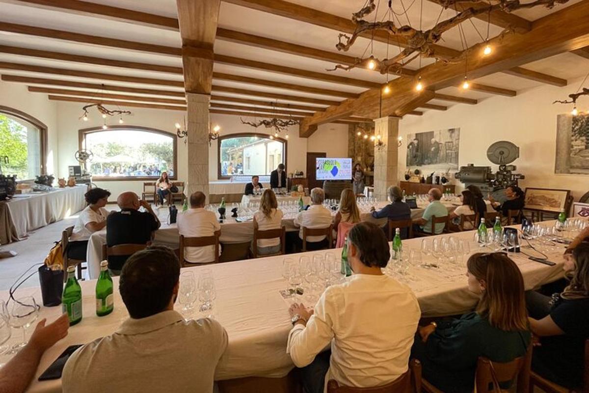 a group of people sitting around a long table in a room
