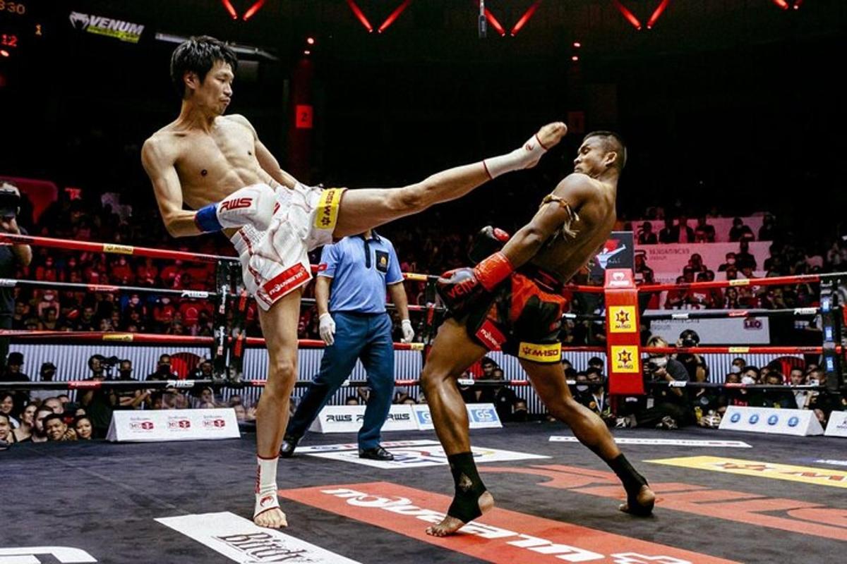two men in a boxing match in a arena