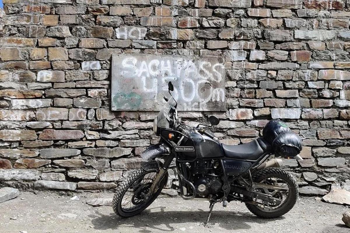 a motorcycle parked in front of a brick wall