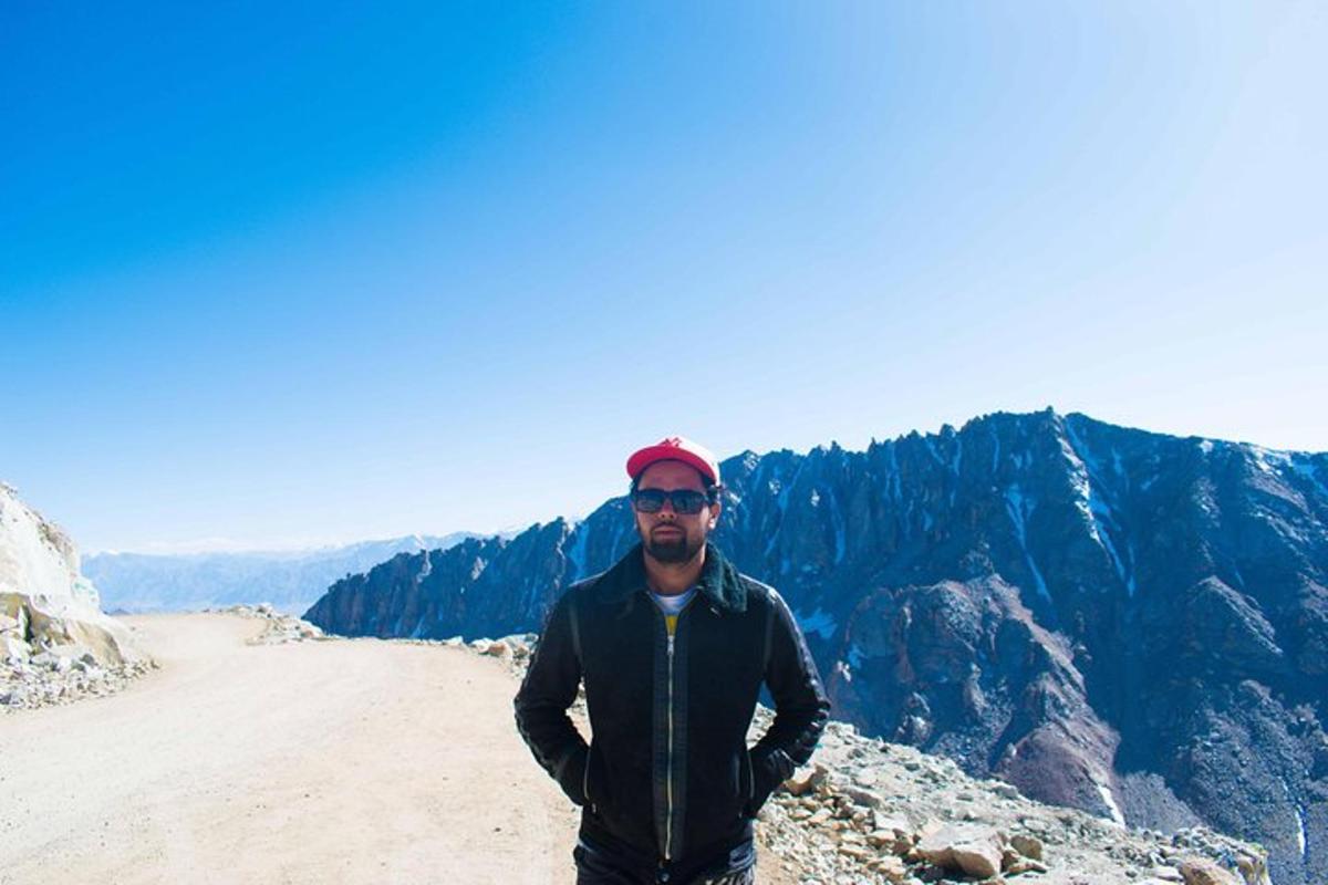a man standing on the top of a mountain
