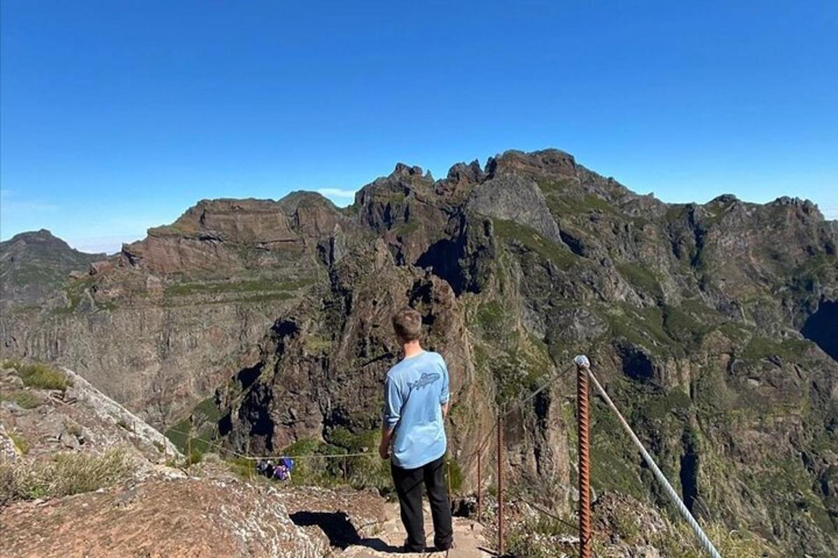 a man standing on top of a mountain