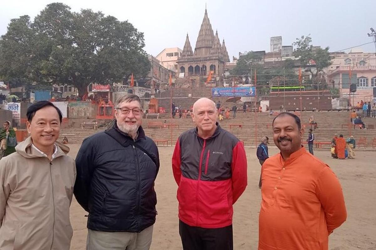 a group of men standing in front of a temple