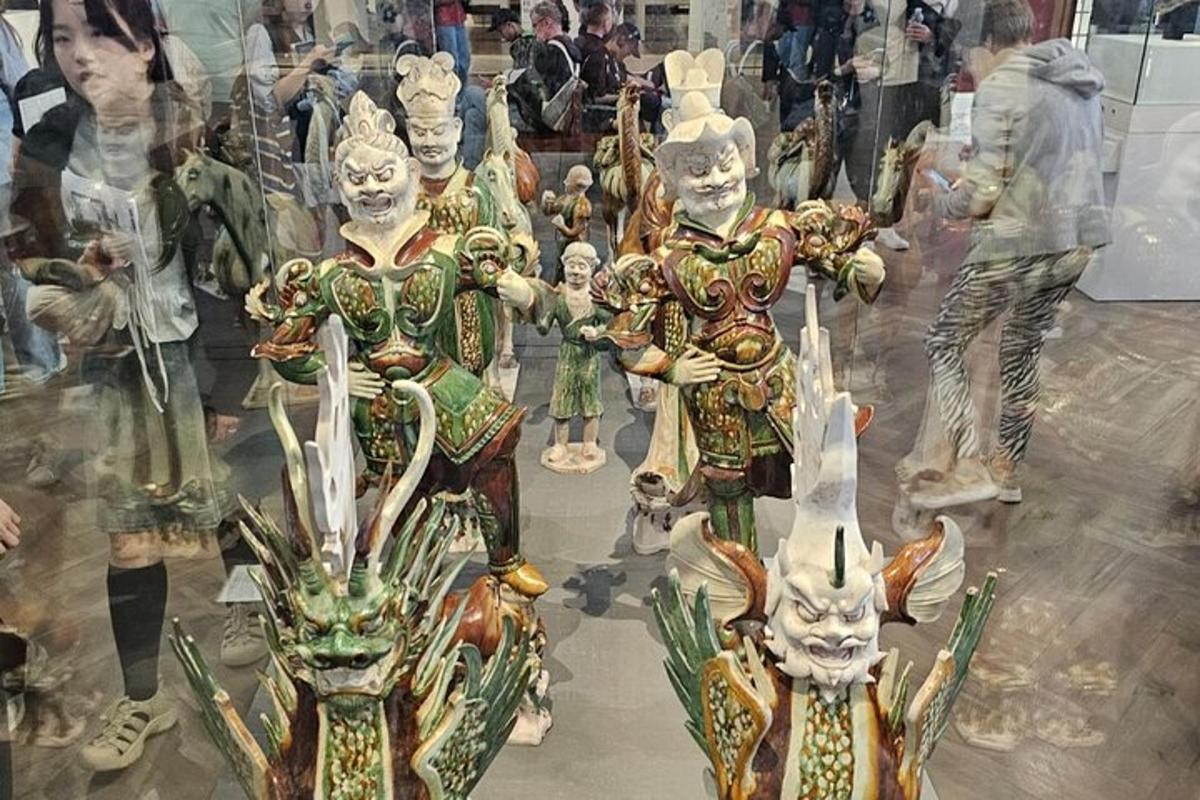 a group of clown statues in a display window
