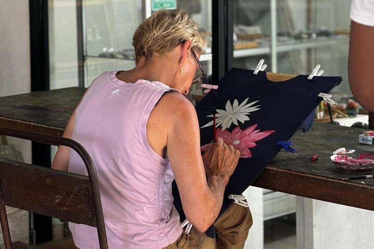 a woman sitting at a table with a pillow