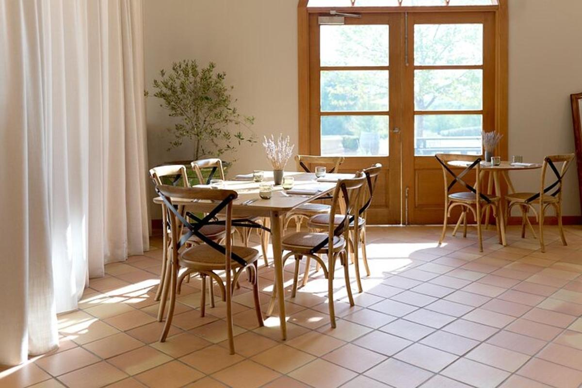 a dining room with a table and chairs