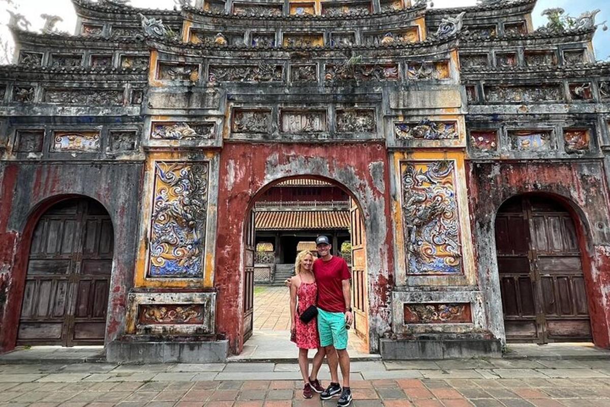 a man and a woman standing in front of a building