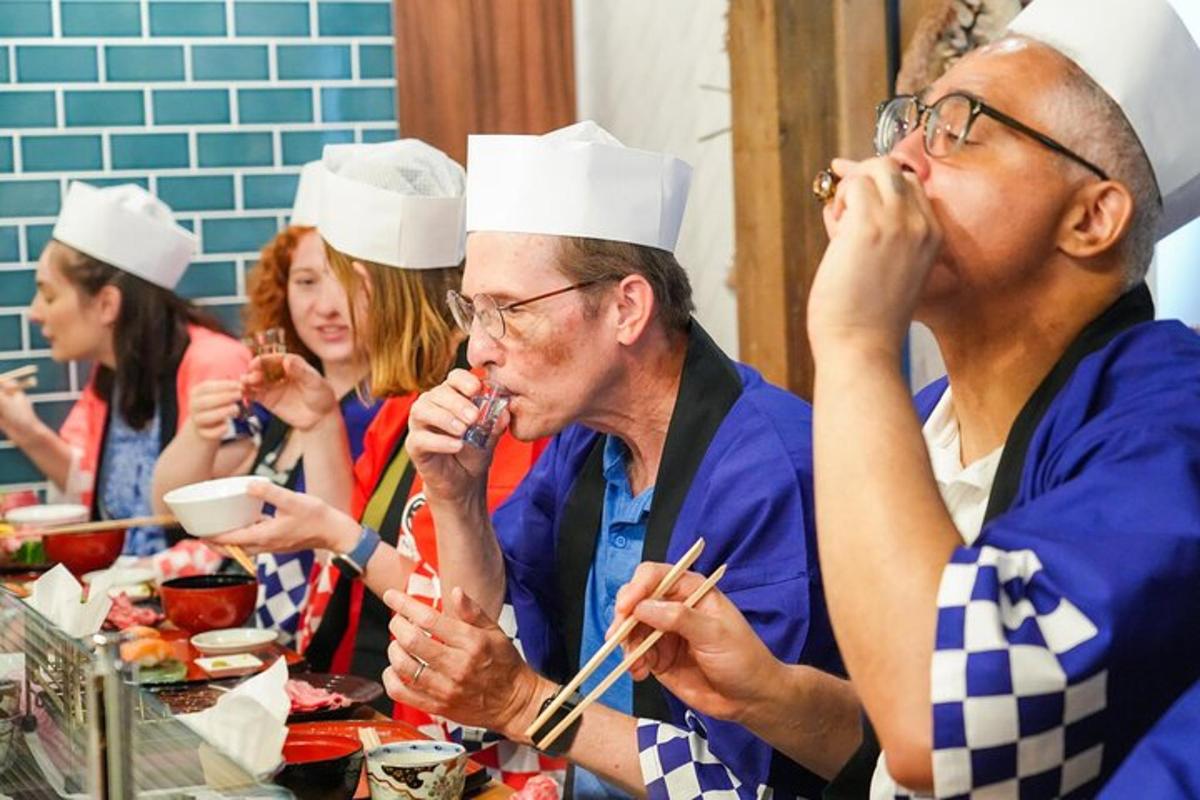 a group of people wearing chef hats eating food