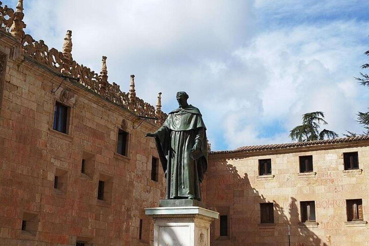 a statue of a man in front of a building