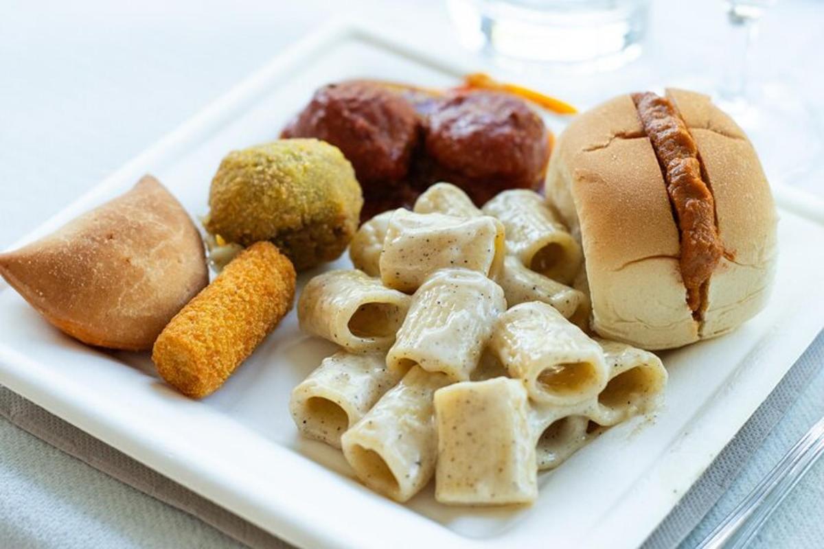 a plate of food with a sandwich and other foods