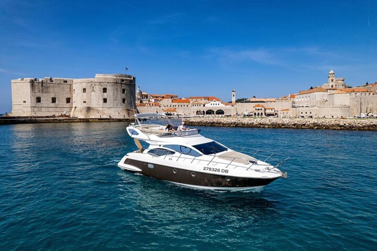 a boat in the water in front of a castle