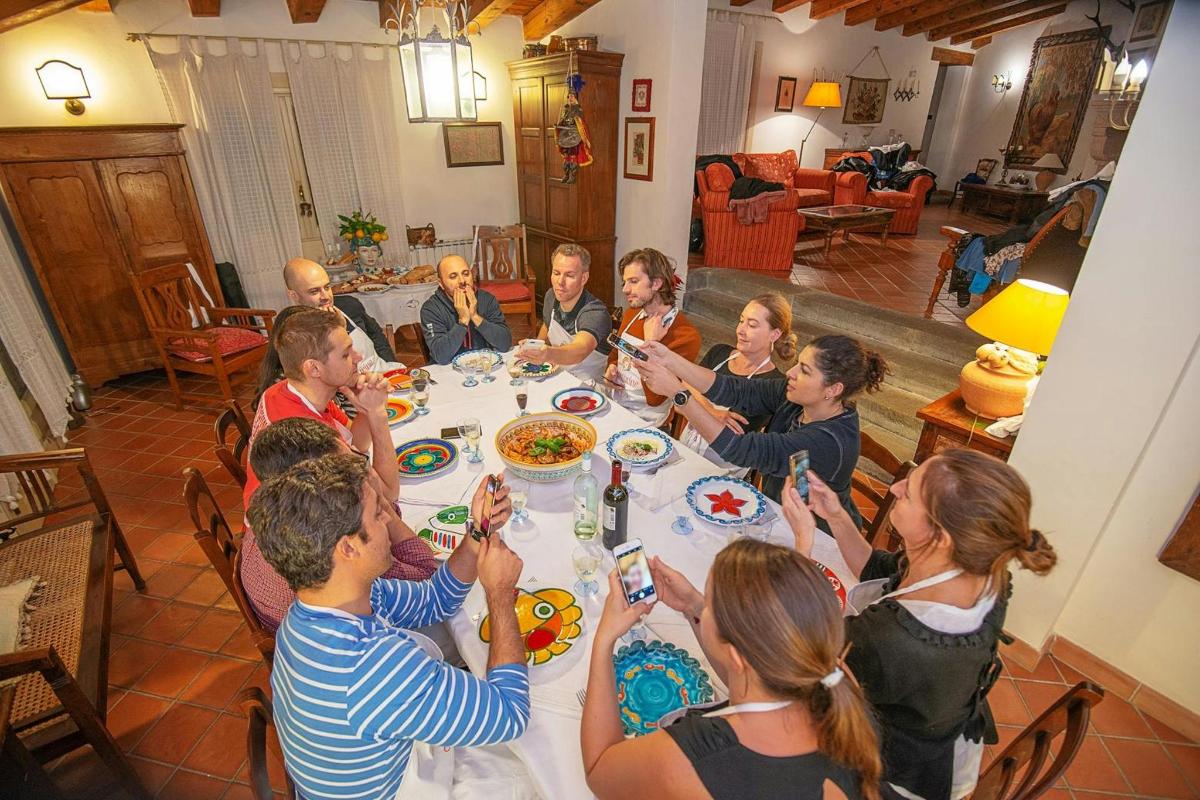 a group of people sitting around a table eating