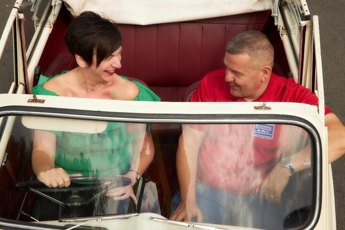 a man and a woman standing in the back of a van
