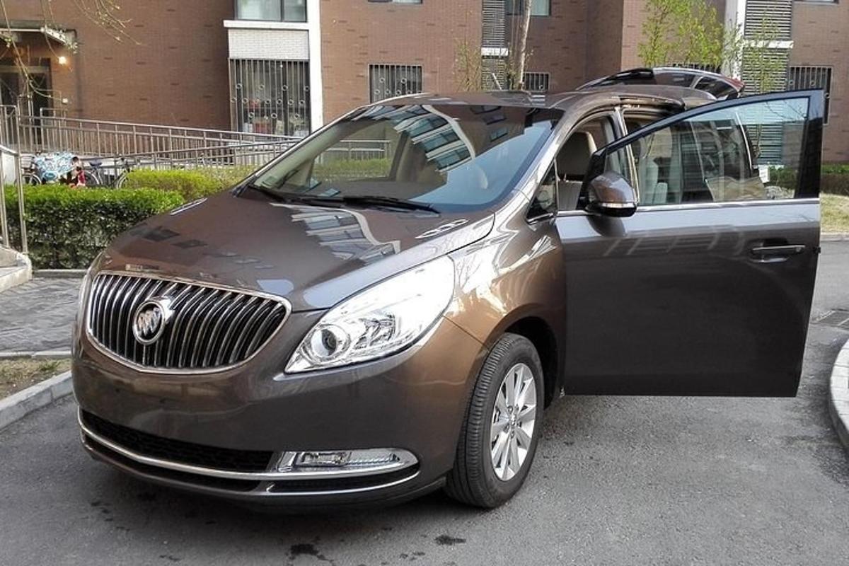 a brown car parked in a parking lot
