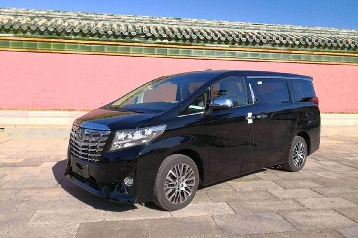 a black car parked in front of a building