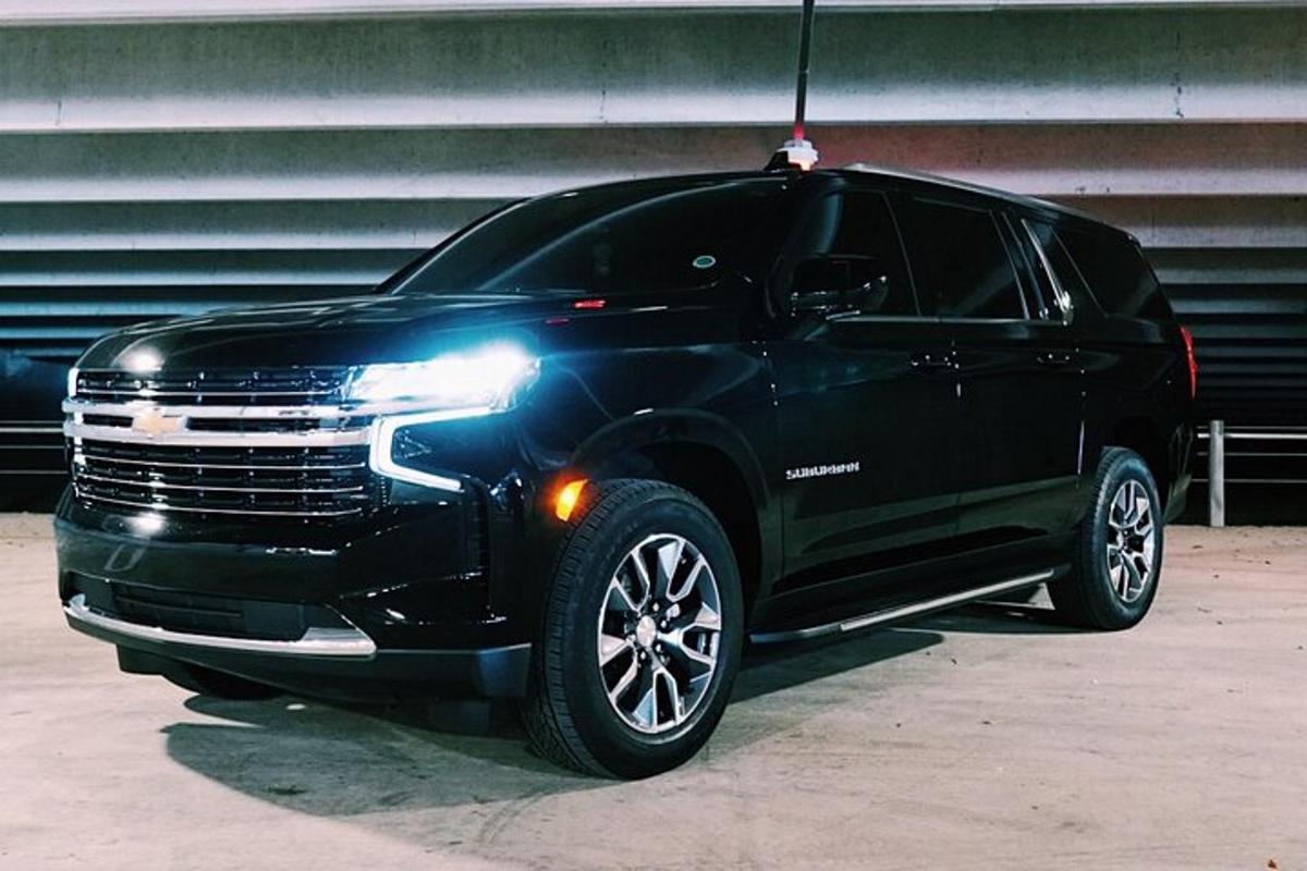a black suv parked in a parking lot