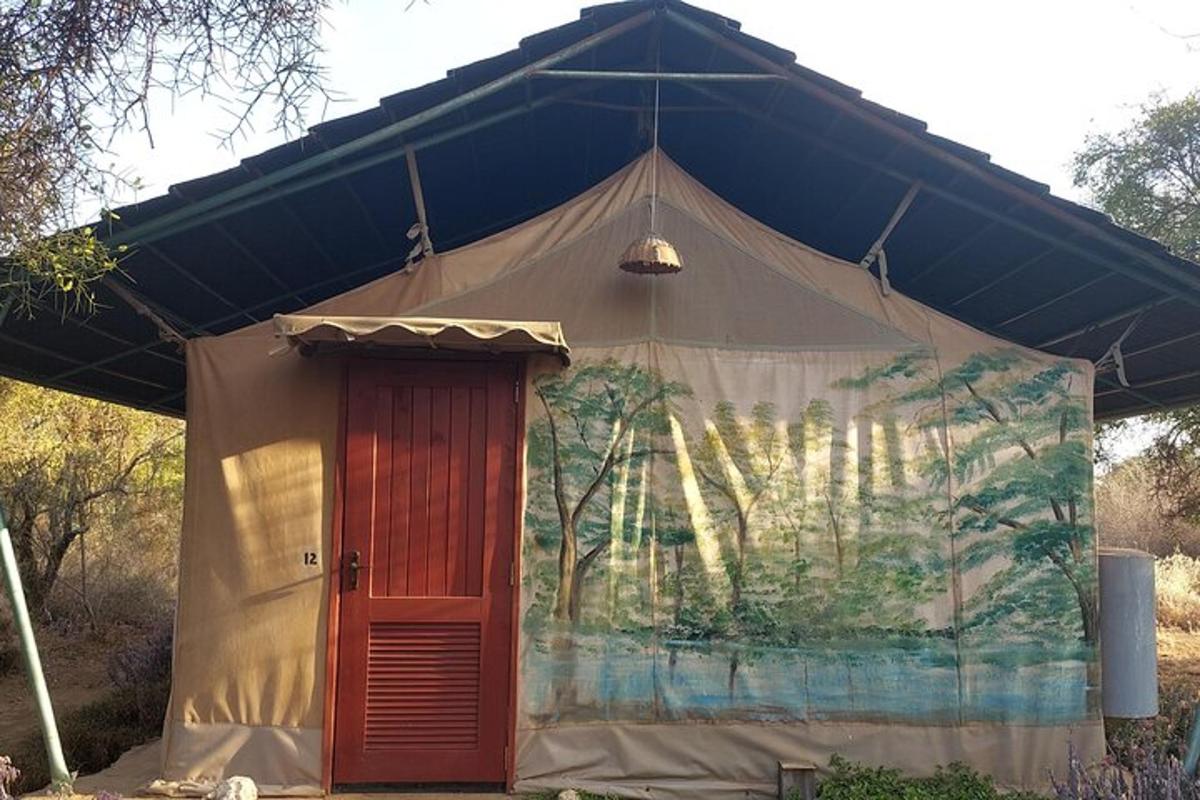 a large tent with a red door in it