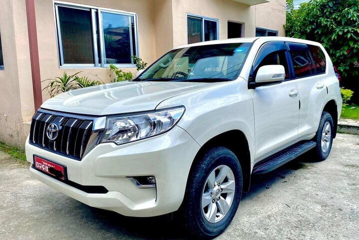 a white truck parked in front of a house