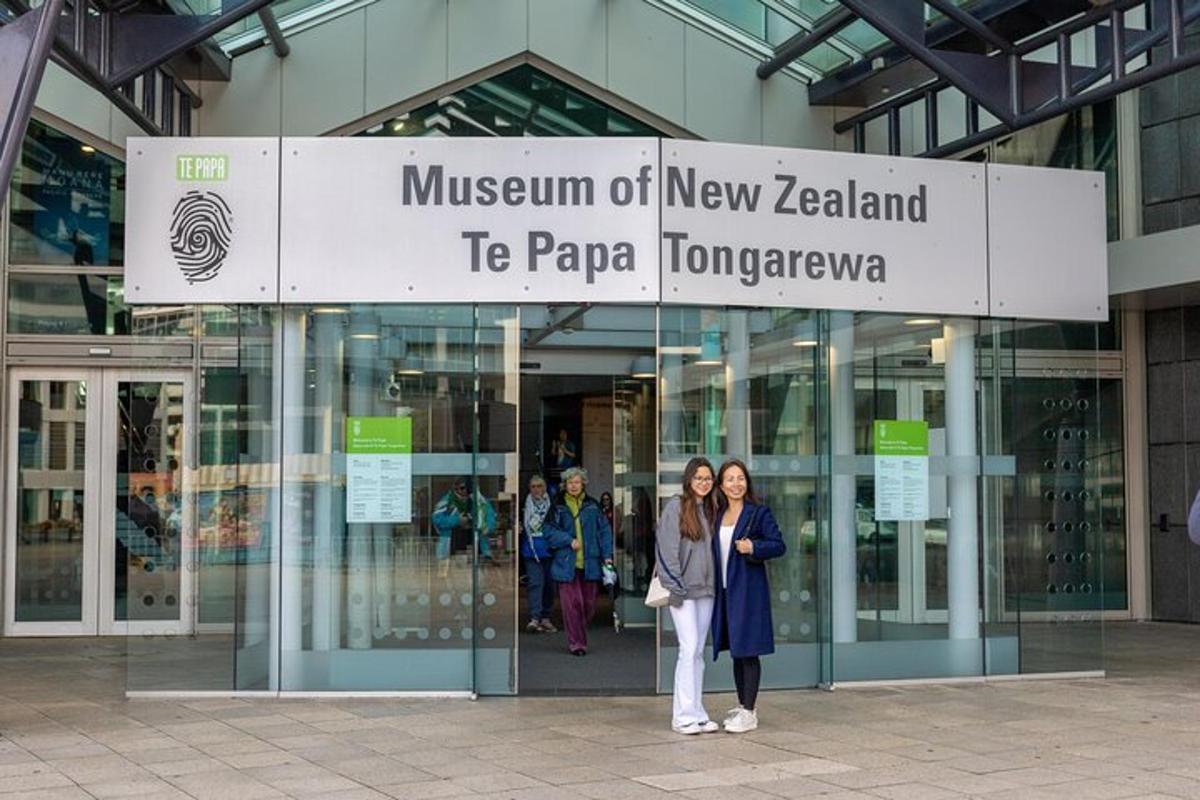 two women standing in front of a building