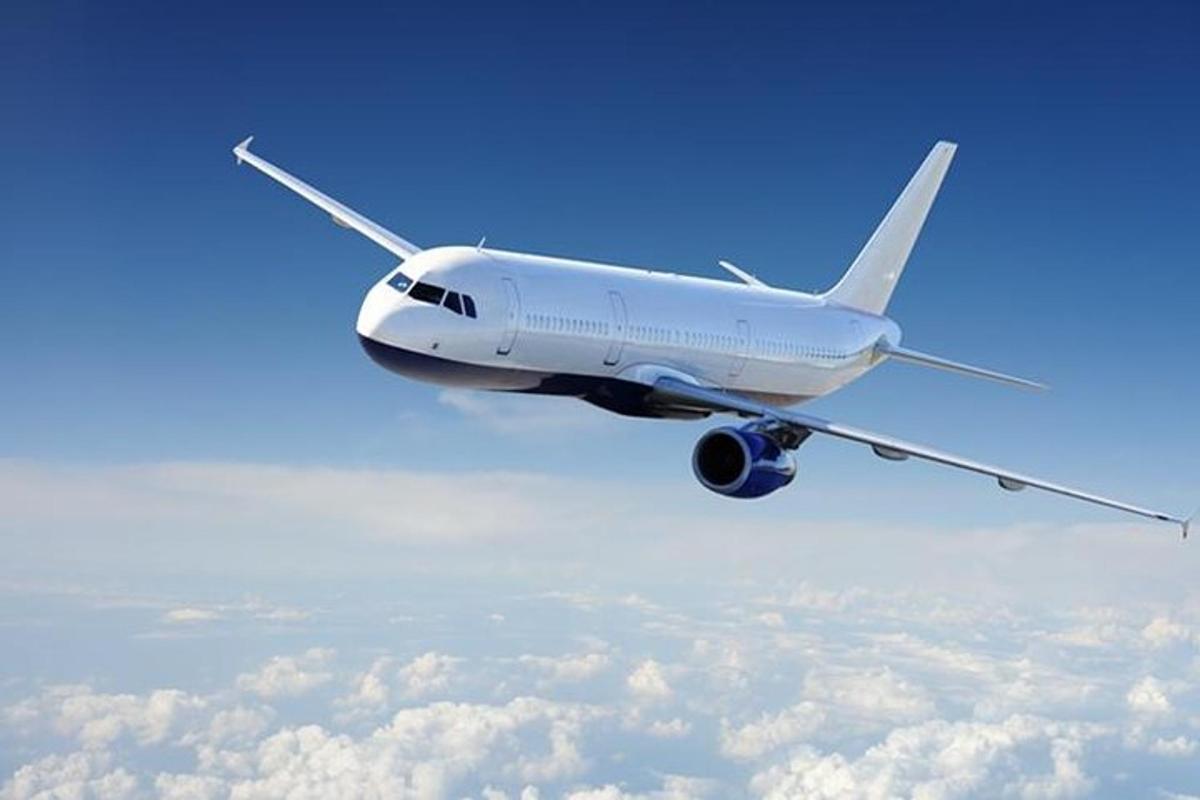 an airplane flying in the sky above the clouds