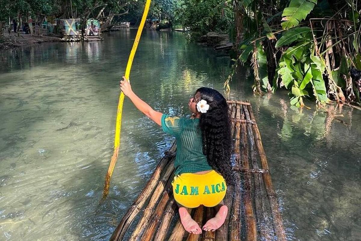 a woman on a raft in the water with a pole