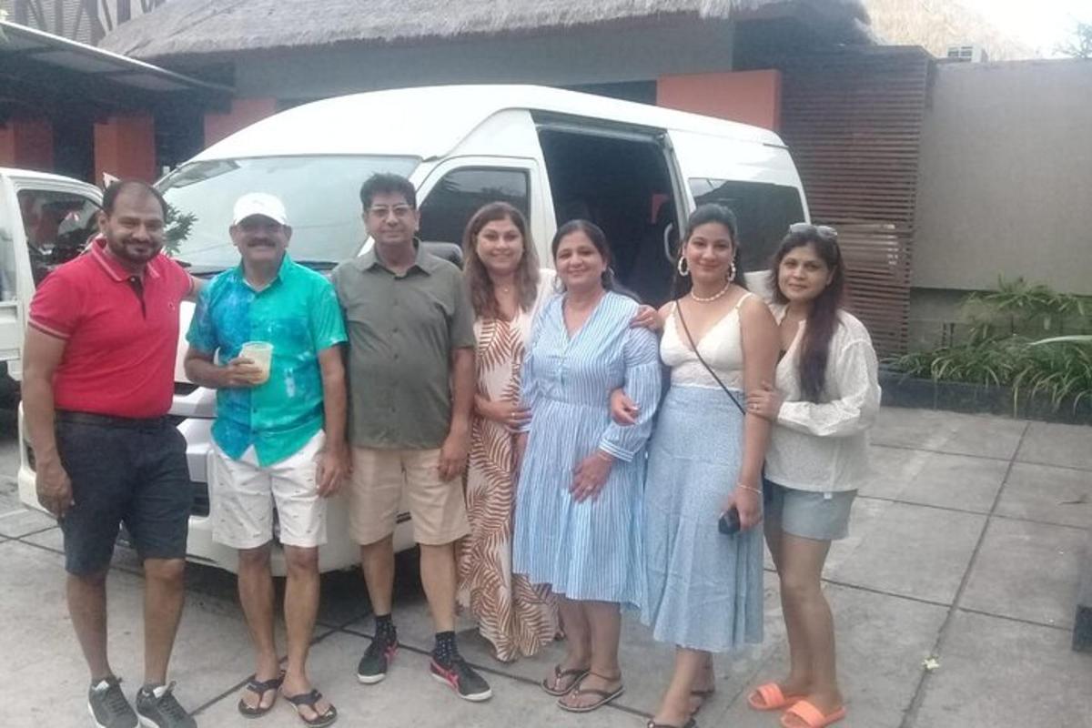 a group of people standing in front of a van